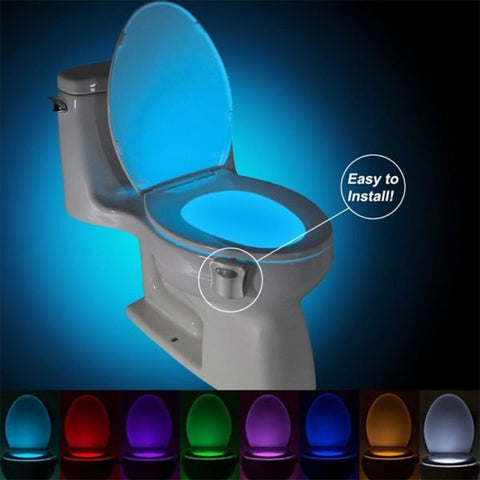Toilet Induction LED Night Light installed on toilet bowl with glowing blue light and color options shown below. Easy to install motion sensor light.