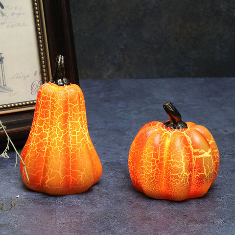 Two Halloween Pumpkin LED Lanterns with lifelike textures on dark background, ideal for seasonal home decor and Halloween displays.