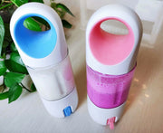 Electric Lemon Juicer Original Manual in pink and blue variants blending milk and fruit. Ideal for travel and quick smoothie preparation.