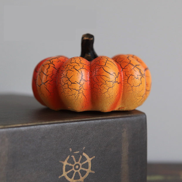 Small Halloween Pumpkin LED Lantern with cracked surface detail, perfect for tabletop decorations and autumn-themed arrangements.