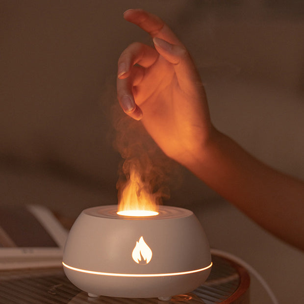 Hand interacting with Flame Aromatherapy USB Diffuser emitting a warm flame-like mist, perfect for nighttime relaxation.