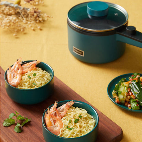 Mini Kitchen Multi-Function Electric Pot with non-stick surface shown cooking noodles and shrimp, ideal for fast home meals.