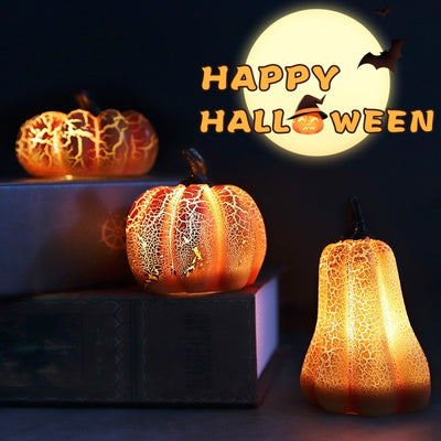 New Halloween Pumpkin Lantern Simulation Pumpkin LED Candle set glowing on books with full moon and festive decor, ideal for spooky displays.