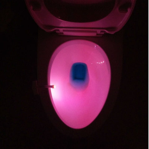 Toilet Induction LED Night Light emitting soft pink glow, ideal for nighttime bathroom use with automatic motion sensing feature.