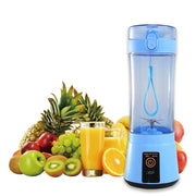 Blue portable USB rechargeable mini blender shown with fresh fruits and juice, perfect for on-the-go smoothie preparation.
