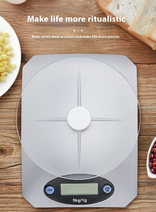 Mini Kitchen Scale Digital Weighing on a wooden surface with food items, promoting accurate meal preparation and portion control.