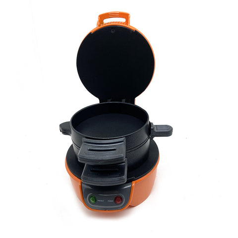 Open orange multifunctional breakfast machine with non-stick cooking plates, ideal for preparing sandwiches and waffles.