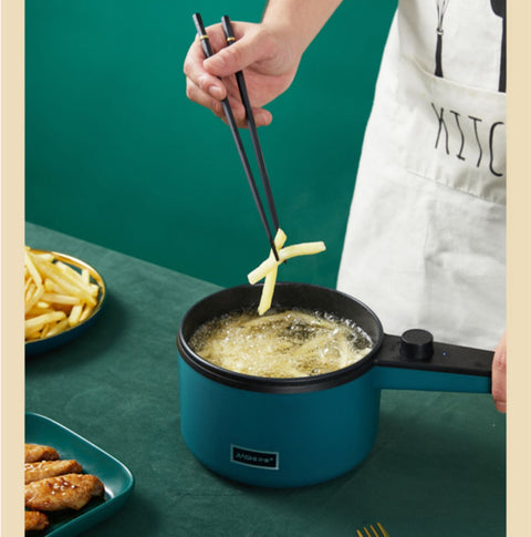 Mini Kitchen Multi-Function Electric Pot frying French fries, showcasing non-stick surface and fast heating capability.