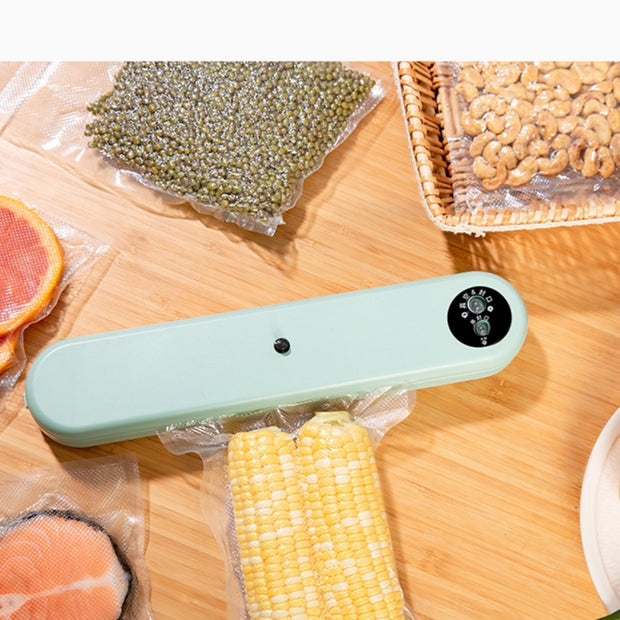 Household Vacuum Sealer - Compact Machine sealing corn and dry foods. 32cm sealer ideal for preserving snacks and grains at home.