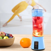 Blue wireless USB juicer blending red fruit drink, ideal for fitness and healthy lifestyle with portable convenience.