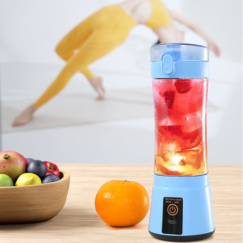 Blue wireless USB juicer blending red fruit drink, ideal for fitness and healthy lifestyle with portable convenience.
