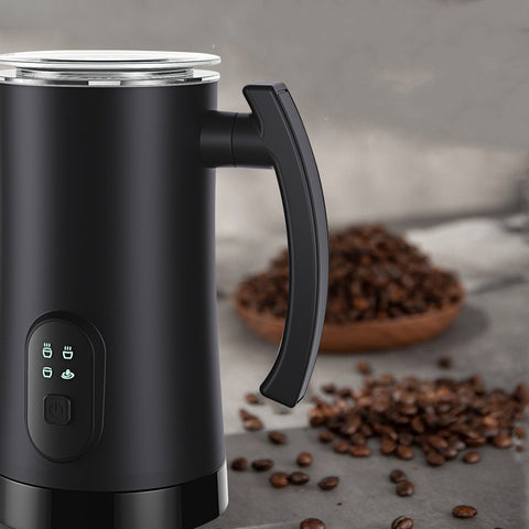 Black Stainless Steel Milk Frother - Electric Machine | 400W, 160ML with ergonomic handle, placed near coffee beans for a modern kitchen setup.