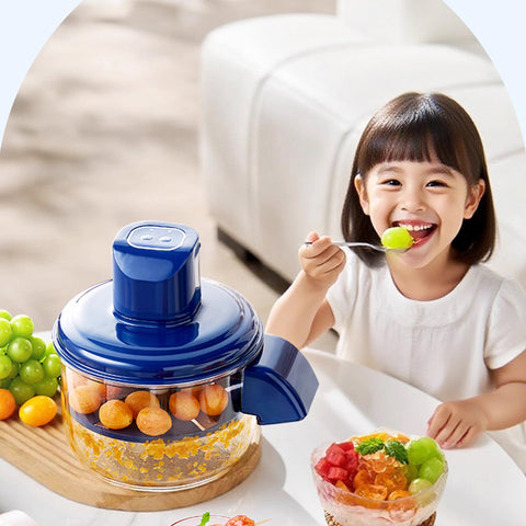 Child eating peeled grapes beside Electric Grape Peeler, demonstrating family-friendly design and safe fruit preparation.